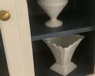 The top with milk glass ang glass doors.