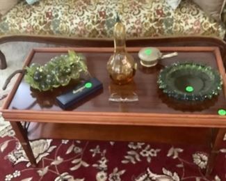 The items on the 60’s coffee table.  Sitting in front of the other Victorian sofa with blues, green and gold.  