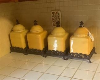 The yellow ceramic and metal canister set.