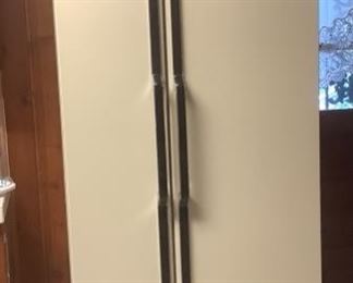 A refrigerator with freezer on one side.