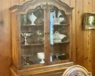 Full view of walnut China cabinet.  Has large metal container on top.