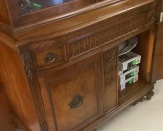 Bottom with beautiful design on China cabinet.