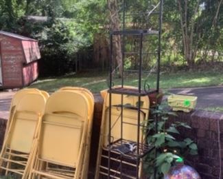 Yellow metal chairs.  Quite a few.  Great when you have a large crowd for cookouts.