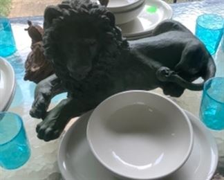 Lion statue, drift wood with little frogs for center piece on patio table.  