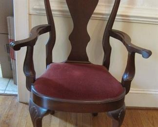 ONE OF THE ARM CHAIRS