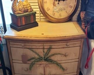 Occasional table with drawers decorated with palm tree, lamp, clock