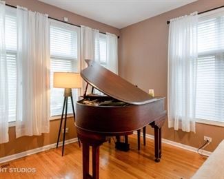 Starck Baby Grand Piano with bench seat.