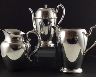 Back: excelsior silver electroplated coffee pot. Front right: excelsior EPC silver over copper ice Pitcher.William a Rogers silver plated water pitcher.