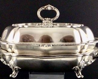 Old chef filled silver plate entrée dish with warming stand. Four piece said early 20th century.