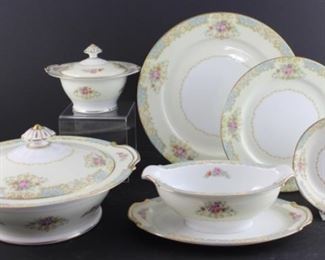 Noritake 1945– 11 dinner plates, 11 salad plates, seven dessert bowls, gravy boat with attached under plate, sugar bowl with lid, covered vegetable bowl.