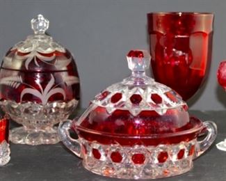 George Duncan & sons red cut to clear crystal butter dish. Pictured front left flashed Ruby 1901 Pan Am Airlines cut crystal(2), pictured front left Nachtmann ruby cut to clear Liqours set of nine from west Germany. pictured back left vintage ruby cut to clear crystal pedestal with lid candy jar. Pictured back right Arlington by Mosser red ice tea glass.