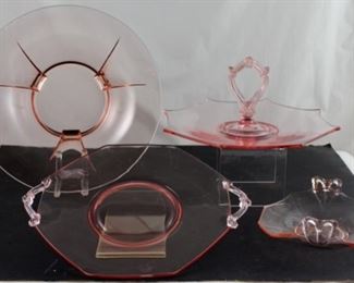 Pictured back left depression era 12 inch round pink footed fruit bowl. pictured back right depression era pink Octagon sandwich tray. pictured front depression era pink Octagon cake plate. Pictured front right depression era pink octagon crimped edge bonbon Tray.
