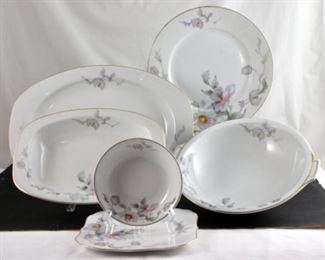 Thun Dinnerware-12 dinner plates, 12 square salad plates, 11 saucers, nine dessert bowls, one platter, two oval vegetable bowls, one round serving bowl.