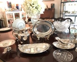 Table Top View of Collection of various Silver Plate serving pieces, etc.