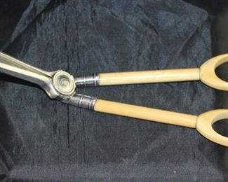 Candlewick cutter with celluloid handle and silver