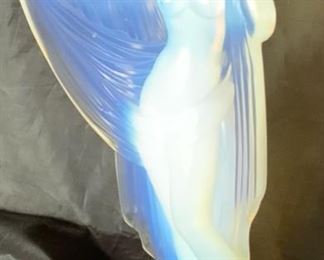 Sabino “Tanagra” Draped Nude Opalescent Figurine. Circa 1930's. Sabino France script marked on bottom. 4 1/4"W x 2 3/4"D x 7 3/4" H. She has a few factory imperfections