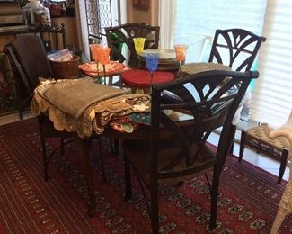 Metal Chairs, Glass Top Table, Decorative Glassware and Dishes. 