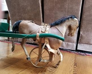 Victorian pram with hide covered, bobbing horse