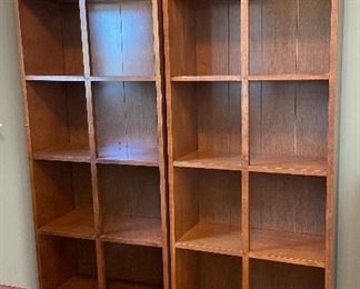 pair of tall matching bookshelves