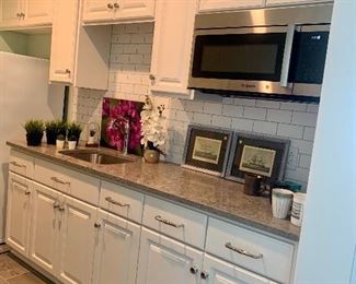 ALL of these kitchen cabinets, stainless sink & faucet (not the microwave) are for sale but to be removed at a later time