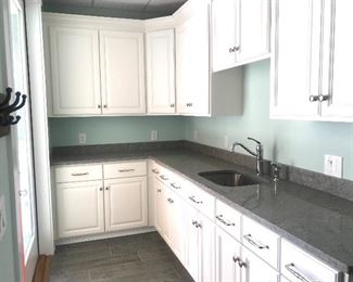More..... White kitchen cabinets, granite countertops, stainless sink