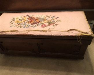 needlepoint top of an antique trunk 