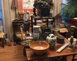 dining room table full of fine pieces dried arrangement in tole planter, blue and white pieces, candlesticks, wooden bowl with sterling base