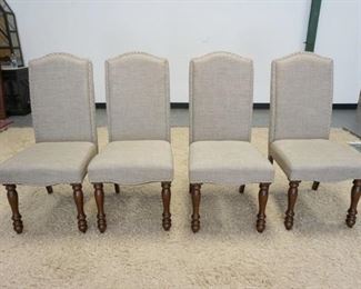 1022	GROUP OF 4 UPHOLSTERED ARM CHAIRS W/NICKLE FINISHED TACKING ACCENTS & TURNED WOOD FRONT LEGS
