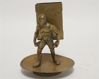 1099	FIGURAL BRASS MATCHBOOK HOLDER SAYS *RUB LIGHTLY* ON THE FRONT. 5 1/4 IN H 
