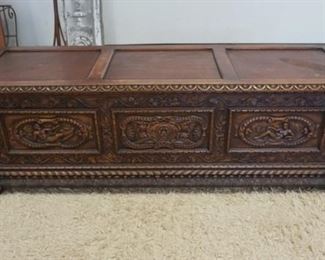 1135	HEAVILY CARVED BELGIAN BLANKET CHEST WITH LION HEADS, PEOPLE, ETC. 63 IN WIDE X 20 IN HIGH X 20 IN DEEP
