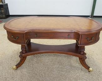 1138	HOOKER SEVEN SEAS LEATHER TOP DESK, WITH BRASS FEET AND CASTORS. 60 IN X 32 IN X 30 1/2 IN HIGH
