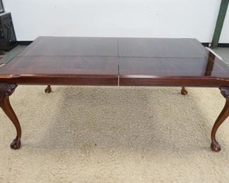 1172	THOMASVILLE DINING ROOM TABLE WITH BANDED TOP ON CABRIOLE BALL AND CLAW LEGS. 2 LEAVES. 76 IN X 45 IN X 30 IN HIGH
