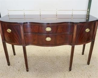 1173	HARDEN SIDEBOARD WITH BRASS GALLERY TOP AND BELLFLOWER INLAID LEGS. 66 IN X 24 IN X 41 IN HIGH
