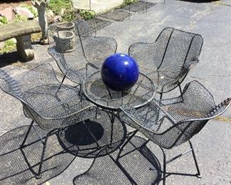 Set of 4 Wire Mesh Patio Bucket Style Chairs by Woodard          Small  side table, not the same style as the chairs.