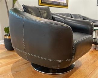 Close up of Zuri Black Leather Swivel Chair - Part of 2 PC set