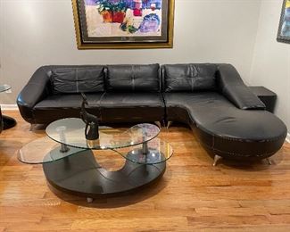 $3000 - 2 PC Set - Zuri black leather sectional sofa and swivel chair - Sofa measures 74" x 37" x 30", Chaise measures 45" x 76" x 30", Swivel chair measures 37" x 36" x 30"