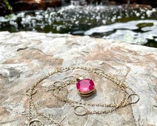 $360 - 14k Chain, 42" length, with rough cut pink ruby pendant set in sterling