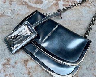 $140 - Dolce & Gabbana Metallic Clutch. Minor wear noted.