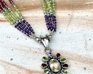 $350 - Semi-precious gemstone set in sterling silver pendant