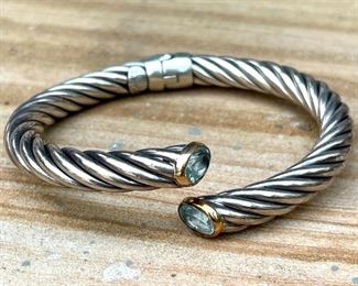 $350 - Women's sterling cable bracelet with 14k rim and and precious stone