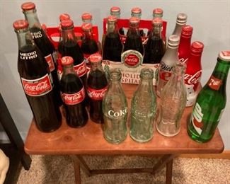 Coca Cola bottles. Various sizes