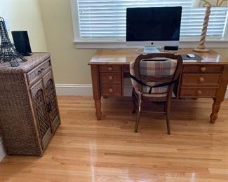 Desk, wicker storage, chair and Apple computer