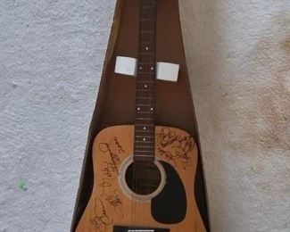 Johnson guitar, heavily autographed 