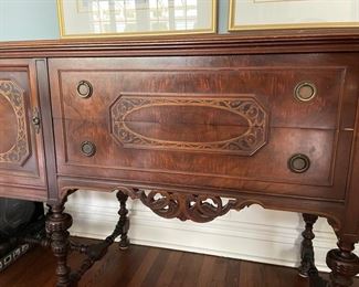 Antique Jacobean-style buffet with carved wood turned legs and floral cartouche detailing. Circa 1920. Measures 72" W x 22"D x 38" H. Photo 2 of 2.