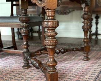 Stunning antique Jacobean-style mahogany dining room table set! Circa 1920. Table features hand carved turned wood legs. It measures 64" L x 43" W. Extends to 95.5" L with three 10.5" leaves. Comes with pads. Photo 2 of 6.