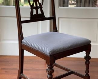 Stunning antique mahogany dining room table set! Circa 1920. Chairs are updated with modern blue ticking upholstery. There are two arm chairs and six side chairs. Photo 5 of 6.