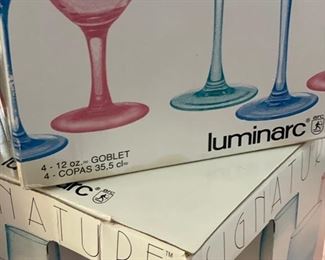 4 boxes of 12-ounce Luminarc Signature wine glasses. One box is missing one glass. Photo 2 of 2.