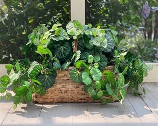 Faux greenery in decorative basket. Three available.