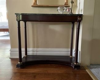 Marble-topped console table. Measures 35" W x 13" D x 30" H.