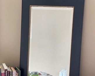 Black Carver's Guild mirror with gold trim. Measures 39" H x 23" W.